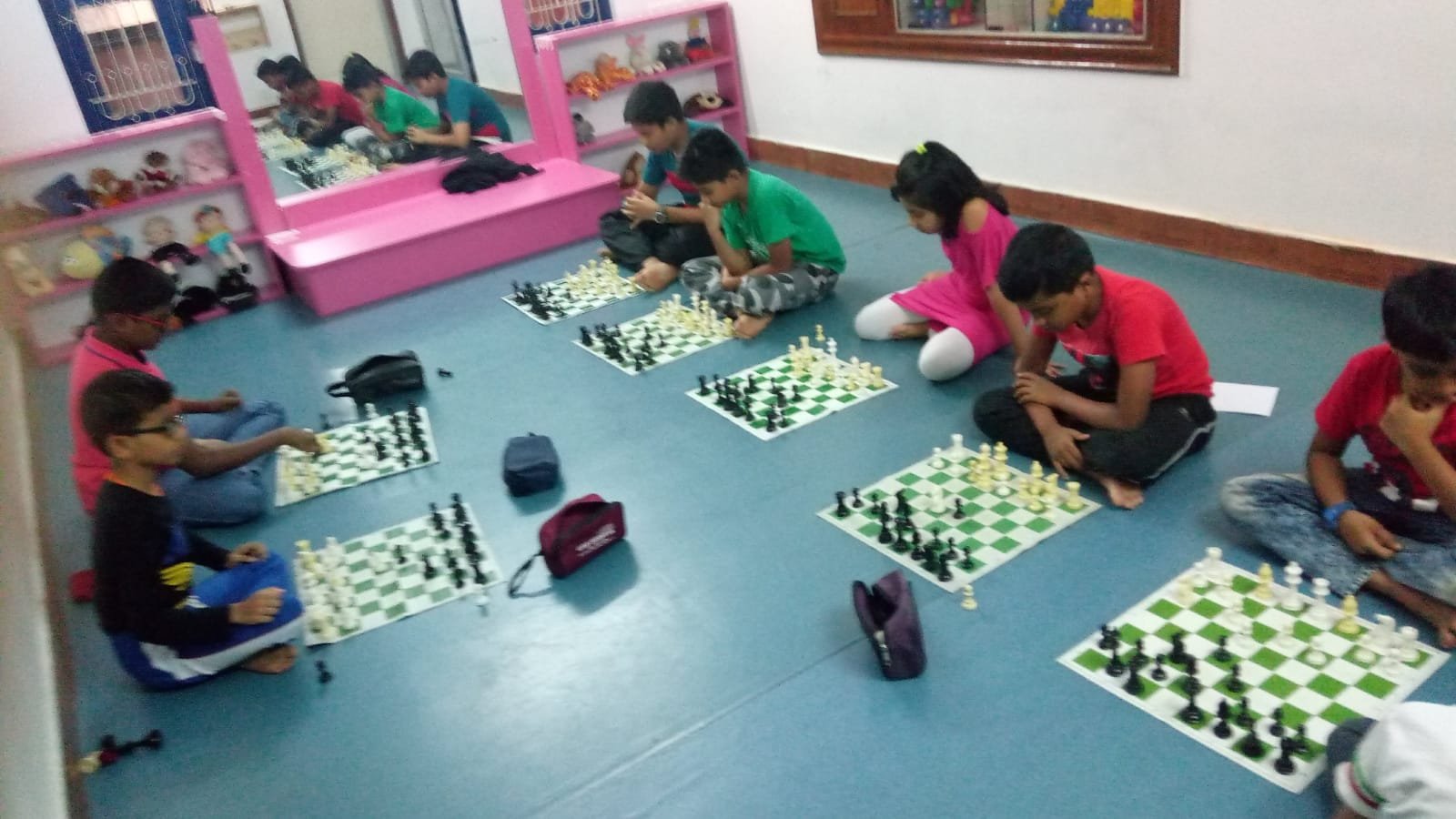 Students playing chess during a group session at Platinum Chess Academy